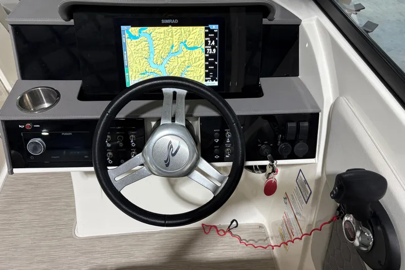  Yacht Photos Pics 2022 Sea Ray SDX 270 Outboard dashboard with steering wheel and navigation display.