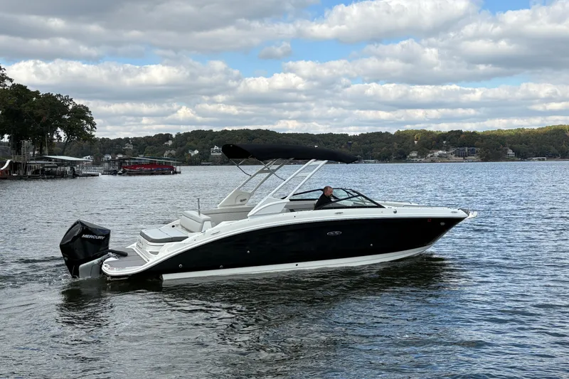  Yacht Photos Pics 2022 Sea Ray SDX 270 Outboard boat cruising on a scenic lake.