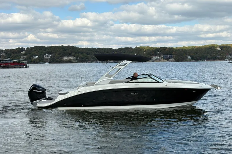  Yacht Photos Pics 2022 Sea Ray SDX 270 Outboard boat cruising on a scenic lake.