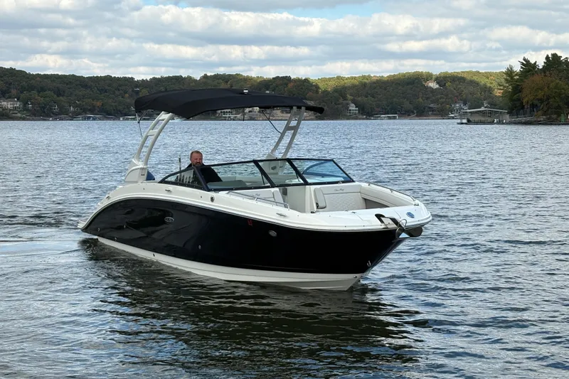  Yacht Photos Pics 2022 Sea Ray SDX 270 Outboard boat cruising on a scenic lake.