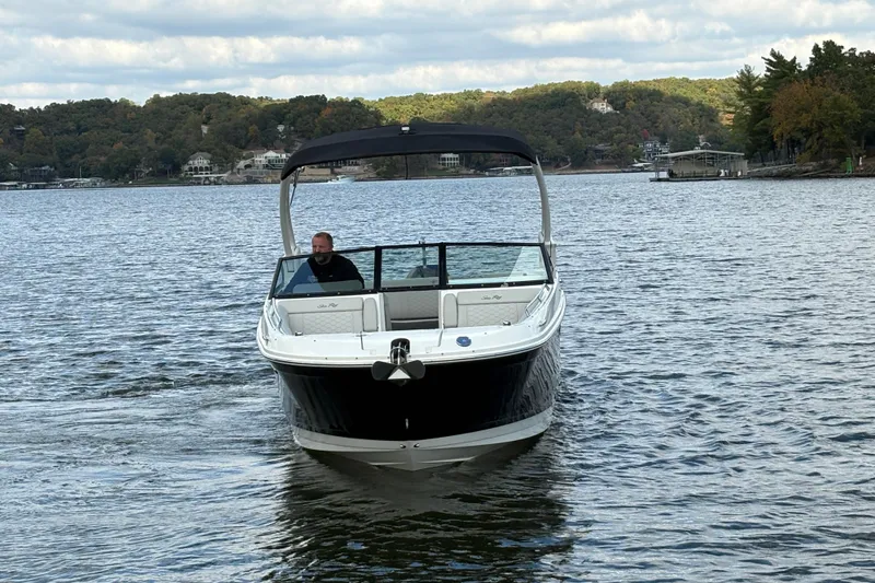  Yacht Photos Pics 2022 Sea Ray SDX 270 Outboard boat cruising on a scenic lake.