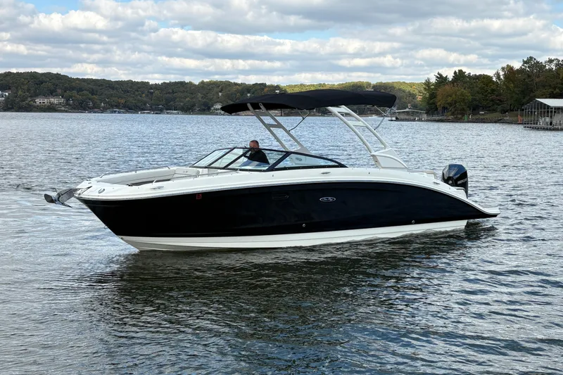  Yacht Photos Pics 2022 Sea Ray SDX 270 Outboard boat cruising on a scenic lake.