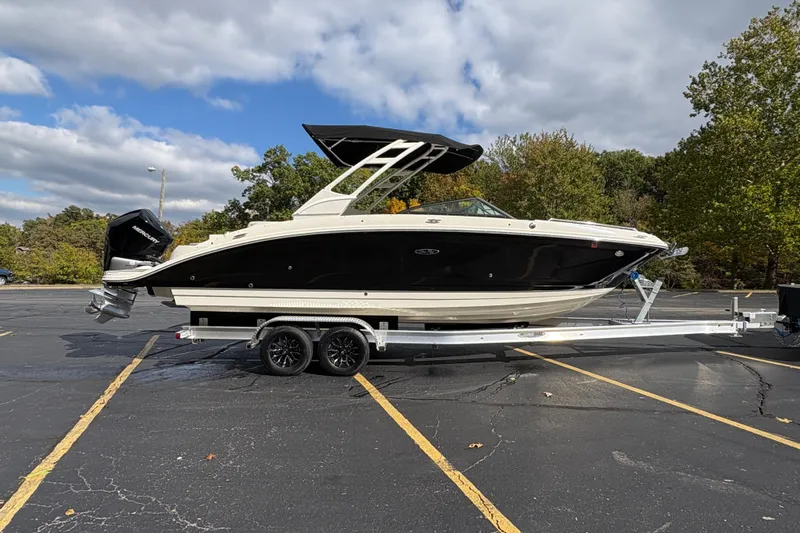  Yacht Photos Pics 2022 Sea Ray SDX 270 Outboard boat on trailer in parking lot.