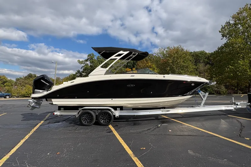  Yacht Photos Pics 2022 Sea Ray SDX 270 Outboard boat on trailer in parking lot.
