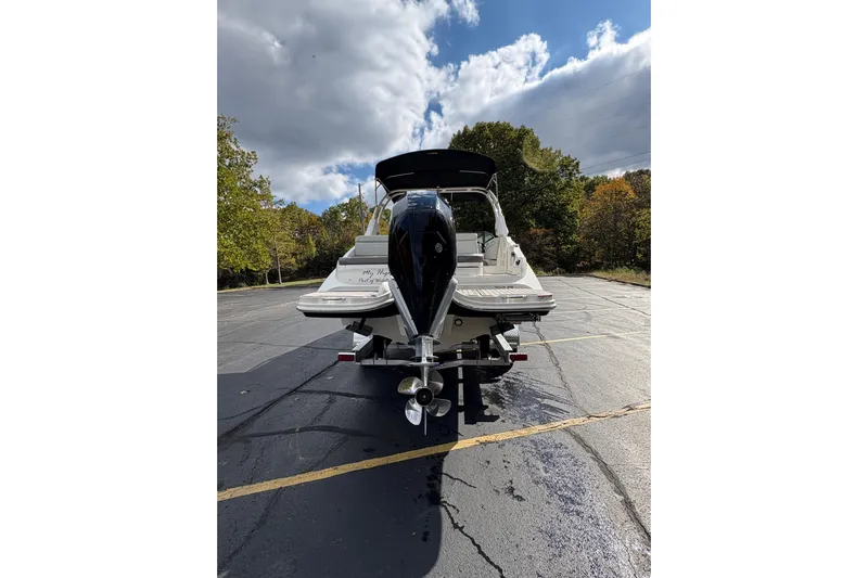  Yacht Photos Pics 2022 Sea Ray SDX 270 Outboard boat parked on asphalt under cloudy sky.