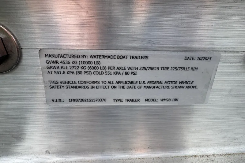  Yacht Photos Pics Label on a Watermade Boat Trailer, model WM28-10K, with specifications and safety standards.