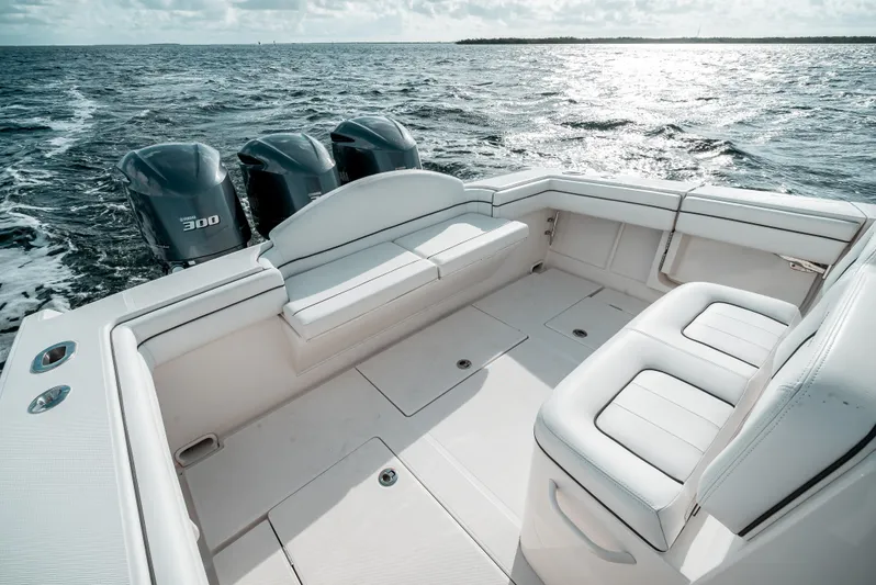  Yacht Photos Pics 2019 Jupiter 34FS boat with triple engines on open water.