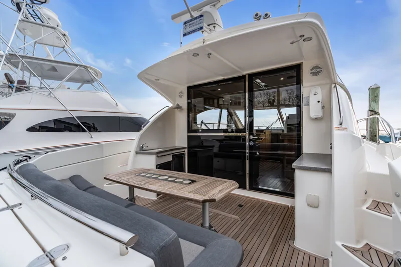 Ayeroller Yacht Photos Pics 2014 Riviera 44 Sport Yacht with modern deck and seating area.