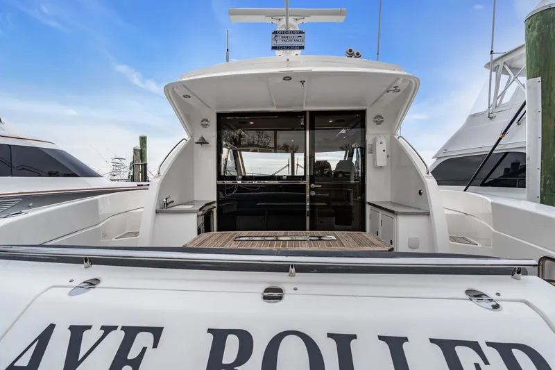 Ayeroller Yacht Photos Pics 2014 Riviera 44 Sport Yacht docked, rear view.