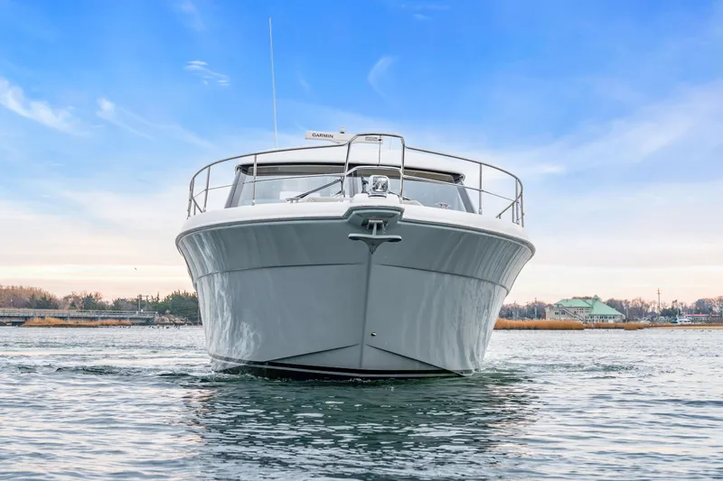 Ayeroller Yacht Photos Pics Riviera 44 Sport Yacht 2014 on calm water under blue sky.
