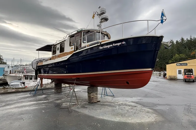 Glasgow Ranger Yacht Photos Pics 2014 Ranger Tugs R-31 boat, "The Glasgow Ranger," elevated on stands in a marina.