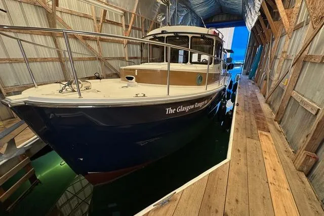 Glasgow Ranger Yacht Photos Pics 2014 Ranger Tugs R-31 boat docked in a covered marina.