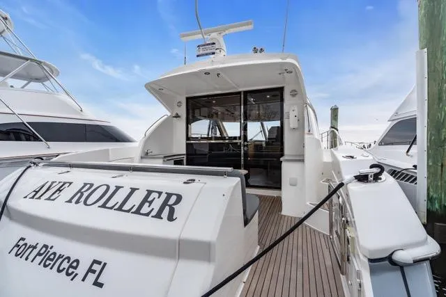 Ayeroller Yacht Photos Pics 2014 Riviera 4400 Sport Yacht docked in Fort Pierce, FL, with open deck view.