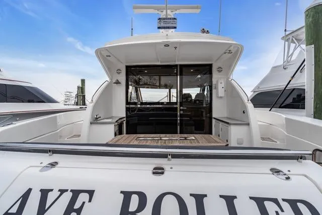 Ayeroller Yacht Photos Pics 2014 Riviera 4400 Sport Yacht with open deck and sleek design, docked at marina.