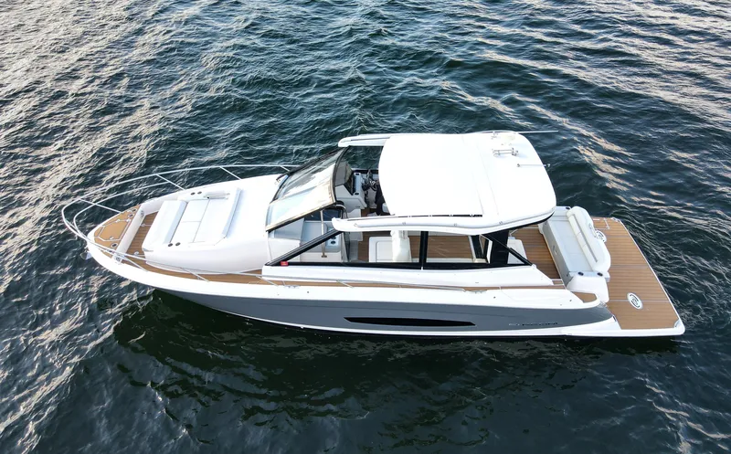 Nightingale Yacht Photos Pics 2023 Regal 36 Grande Coupe cruising on open water.