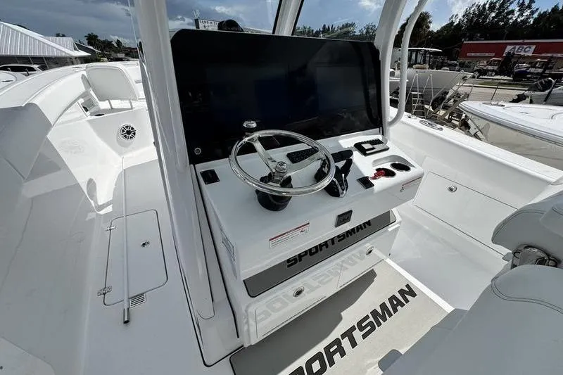  Yacht Photos Pics 2026 Sportsman Heritage 321 Center Console boat interior with steering wheel and controls.