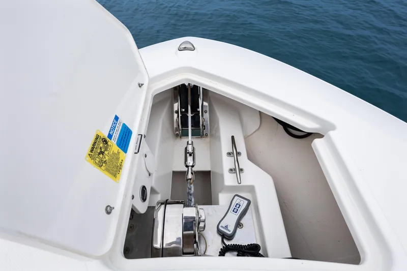Little Perspective Yacht Photos Pics 2019 Pursuit S 288 Sport boat anchor compartment with chain and control panel.