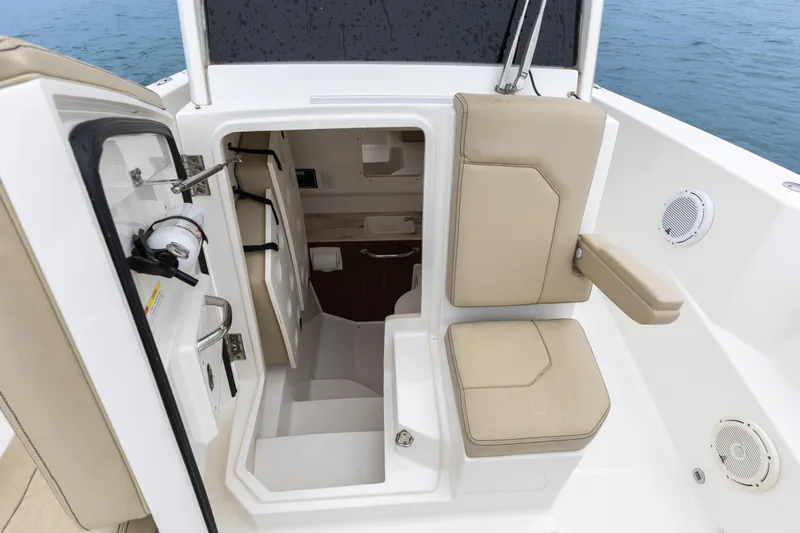 Little Perspective Yacht Photos Pics 2019 Pursuit S 288 Sport boat interior with seating and storage compartments.