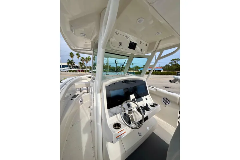  Yacht Photos Pics 2024 Sailfish 312 CC boat cockpit with modern steering and controls.
