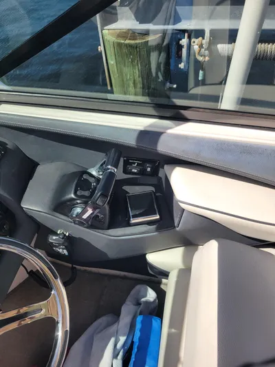  Yacht Photos Pics 2020 Regal 29 OBX boat interior with steering wheel and control panel.