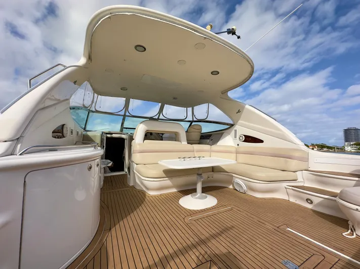  Yacht Photos Pics Luxurious 1999 Sea Ray 540 Sundancer yacht with spacious deck and seating under a clear sky.