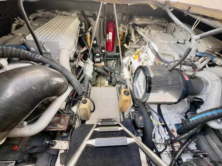  Yacht Photos Pics Engine room of 1999 Sea Ray 540 Sundancer yacht, showcasing dual engines and equipment.