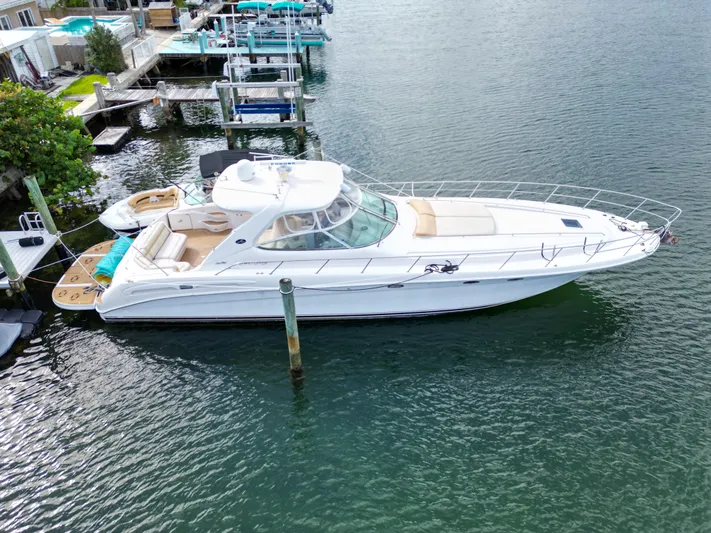  Yacht Photos Pics 1999 Sea Ray 540 Sundancer yacht docked in marina, aerial view.