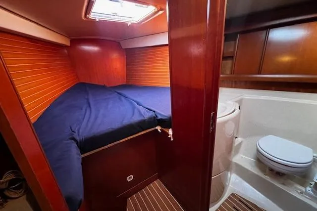 Eagles Wings Yacht Photos Pics Cabin interior of 2003 Grand Soleil 44 yacht with bed and bathroom.