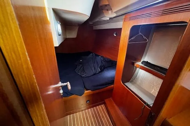 Eagles Wings Yacht Photos Pics Cozy cabin interior of 2003 Grand Soleil 44 sailboat with wooden finish.