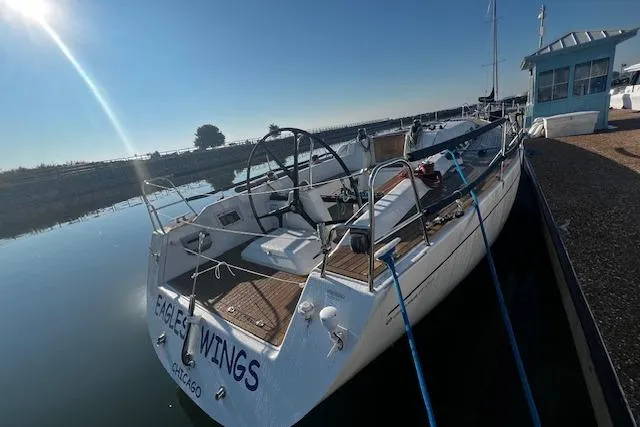 Eagles Wings Yacht Photos Pics 2003 Grand Soleil 44 sailboat docked, sunny day, calm waters, named "Eagle Wings."