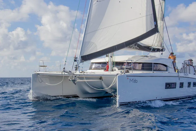  Yacht Photos Pics Sailing catamaran Nautitech 442, 2013 model, cruising on open sea under clear skies.