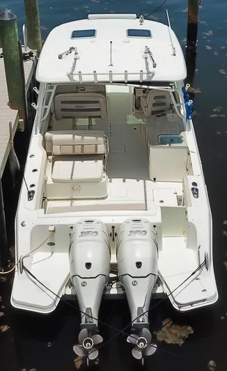Born Free Yacht Photos Pics 2017 Boston Whaler 320 Vantage boat with dual engines, docked in a marina.