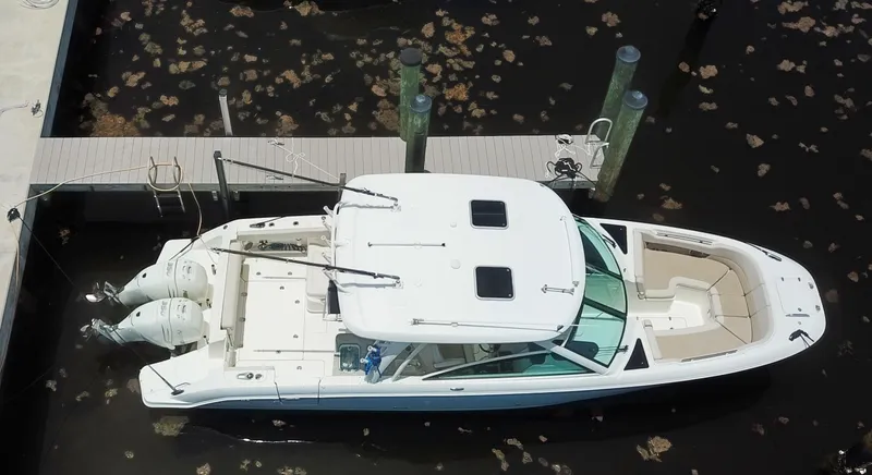 Born Free Yacht Photos Pics 2017 Boston Whaler 320 Vantage docked, aerial view, showcasing sleek design and dual engines.