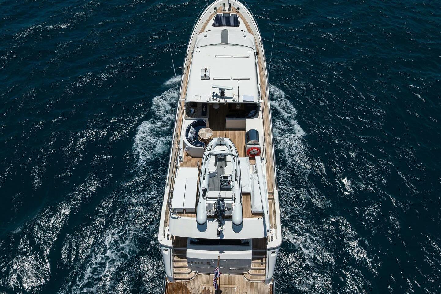 Aerial view of 2005 Pacific Mariner 85 yacht cruising on open sea.
