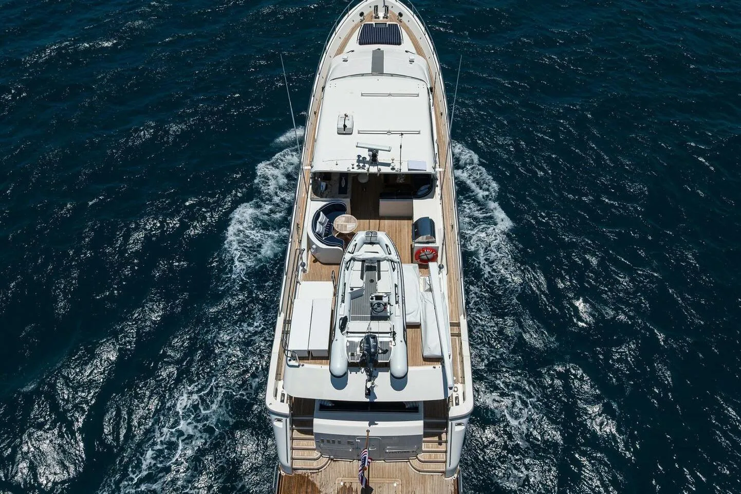 Aerial view of 2005 Pacific Mariner 85 yacht cruising on open sea.
