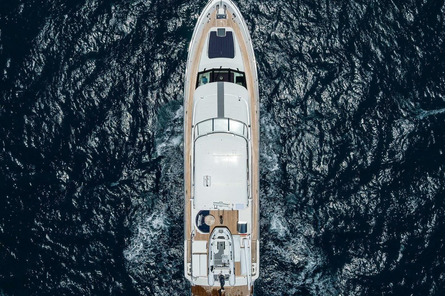 Aerial view of 2005 Pacific Mariner 85 yacht cruising on open sea.