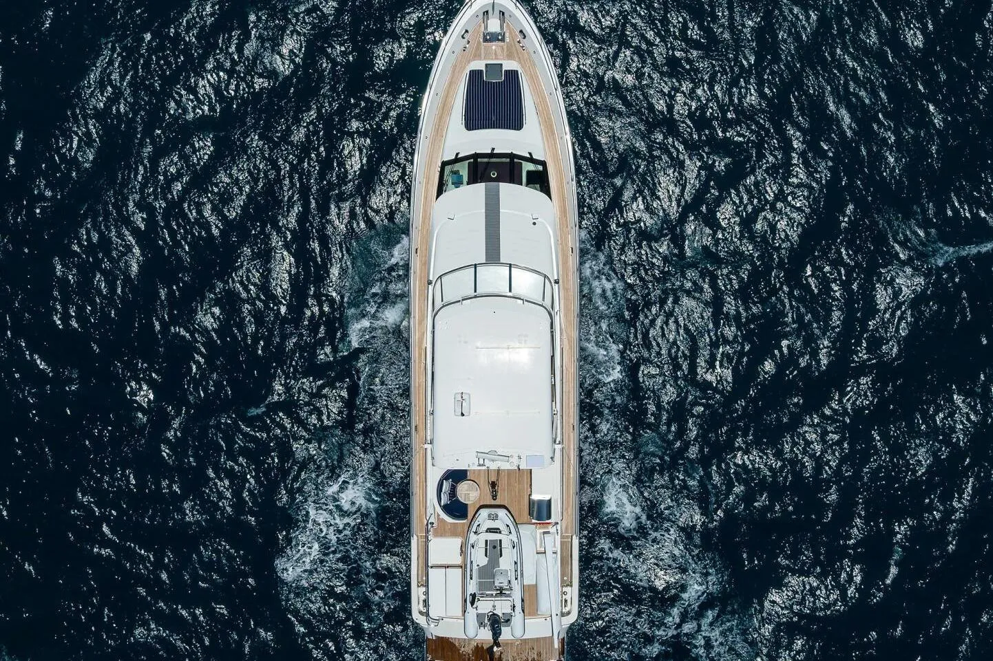 Aerial view of 2005 Pacific Mariner 85 yacht cruising on open sea.
