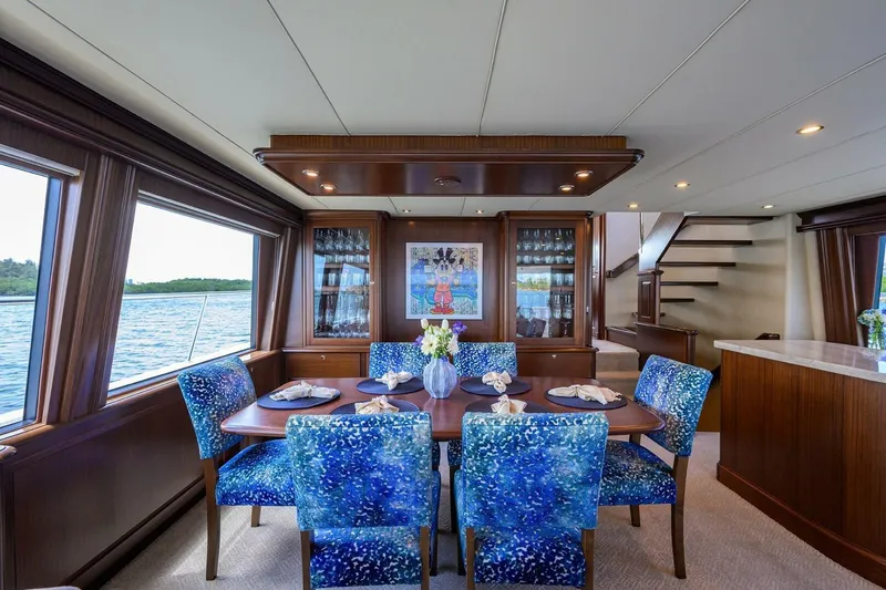 Jule Yacht Photos Pics Luxurious dining area on a 2005 Pacific Mariner 85 yacht with ocean view.