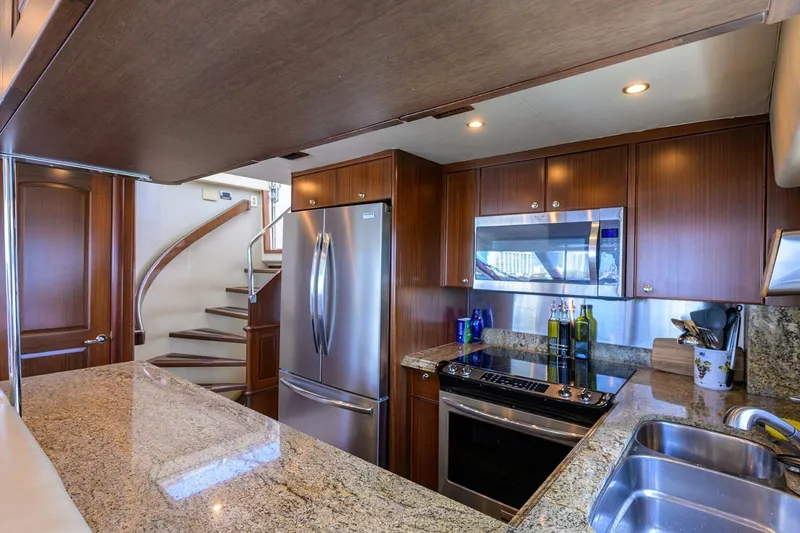 Jule Yacht Photos Pics Luxurious kitchen interior of 2005 Pacific Mariner 85 yacht with granite countertops.