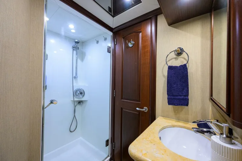 Jule Yacht Photos Pics Luxurious bathroom in 2005 Pacific Mariner 85 yacht with shower and elegant fixtures.