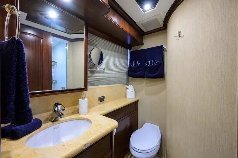Jule Yacht Photos Pics Luxurious bathroom in 2005 Pacific Mariner 85 yacht with elegant fixtures and decor.