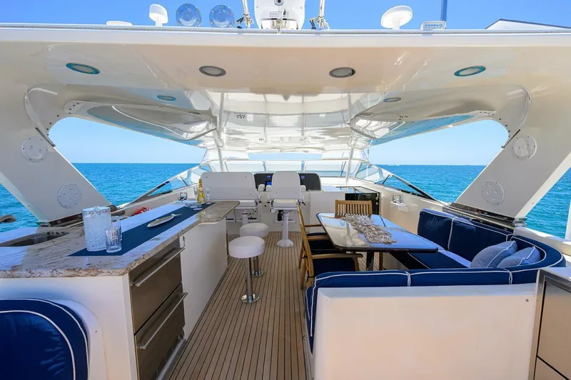 Jule Yacht Photos Pics Luxurious 2005 Pacific Mariner 85 yacht interior with elegant seating and ocean view.