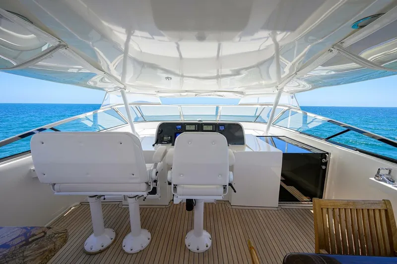 Jule Yacht Photos Pics Helm of 2005 Pacific Mariner 85 yacht with ocean view and seating.