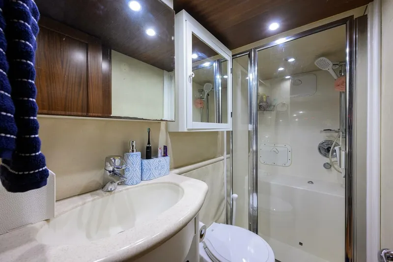 Jule Yacht Photos Pics Luxurious bathroom in 2005 Pacific Mariner 85 yacht with modern fixtures and shower.