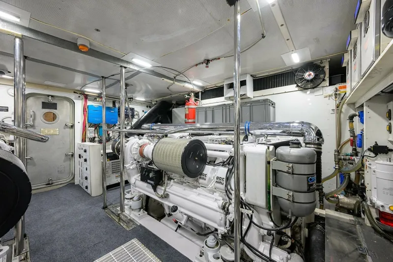 Jule Yacht Photos Pics Engine room of a 2005 Pacific Mariner 85 yacht, featuring advanced machinery and equipment.