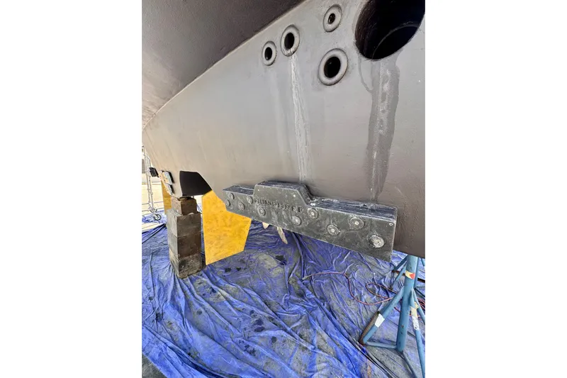 Jule Yacht Photos Pics Bottom view of a 2005 Pacific Mariner 85 yacht on a tarp, showing hull details.