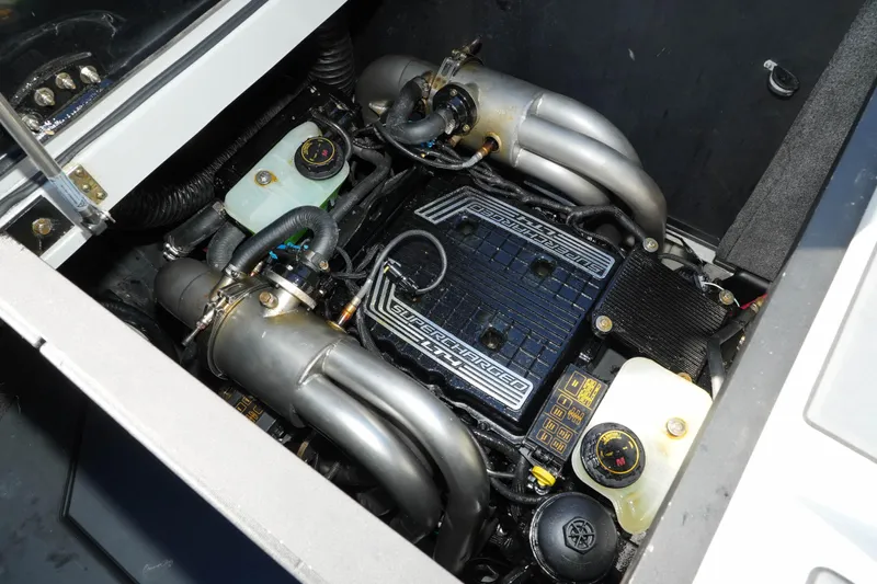  Yacht Photos Pics 2020 Malibu M240 engine compartment showcasing a supercharged engine with visible components.