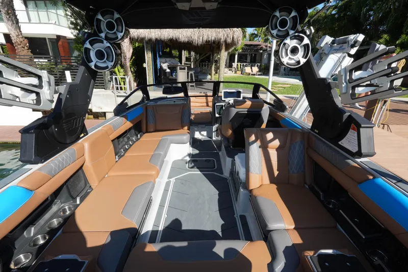  Yacht Photos Pics Interior of a 2020 Malibu M240 boat with luxurious seating and advanced audio system.