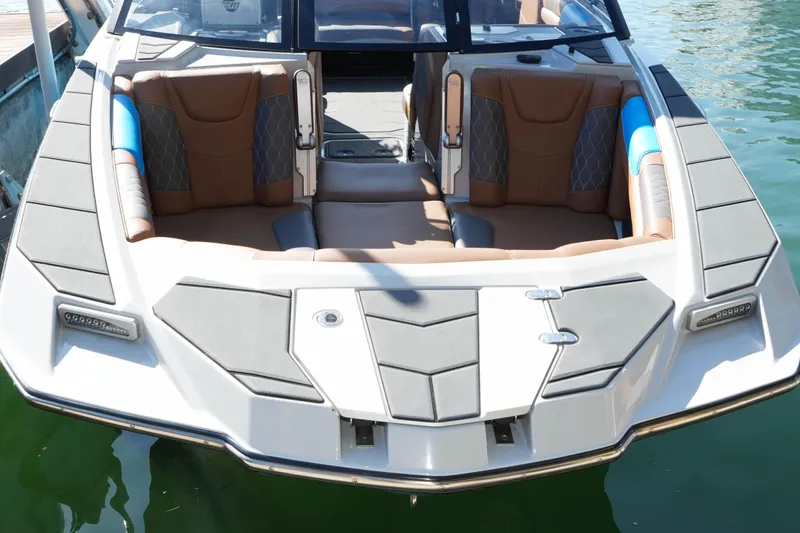  Yacht Photos Pics 2020 Malibu M240 boat with luxurious seating and sleek design on the water.
