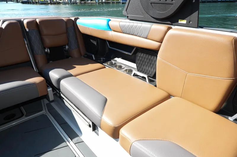  Yacht Photos Pics Luxurious interior seating of 2020 Malibu M240 boat with tan and gray upholstery.